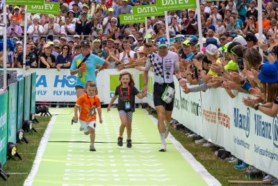 Athletes at the finish line of the 2026 DATEV Challenge Roth